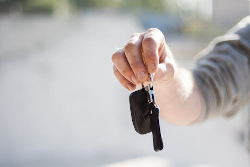 Person holding a new set of car keys after using an auto locksmith service in Las Vegas.