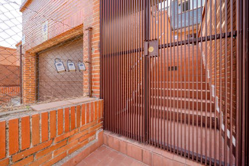 Modern security gate at the entrance of a residential home in Las Vegas, emphasizing tailored home protection.