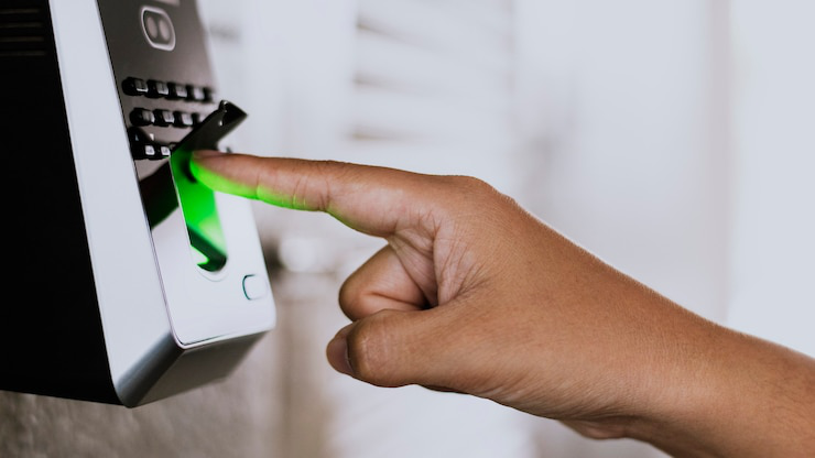  Close-up of a biometric lock with a fingerprint scanner, representing advanced keyless entry systems