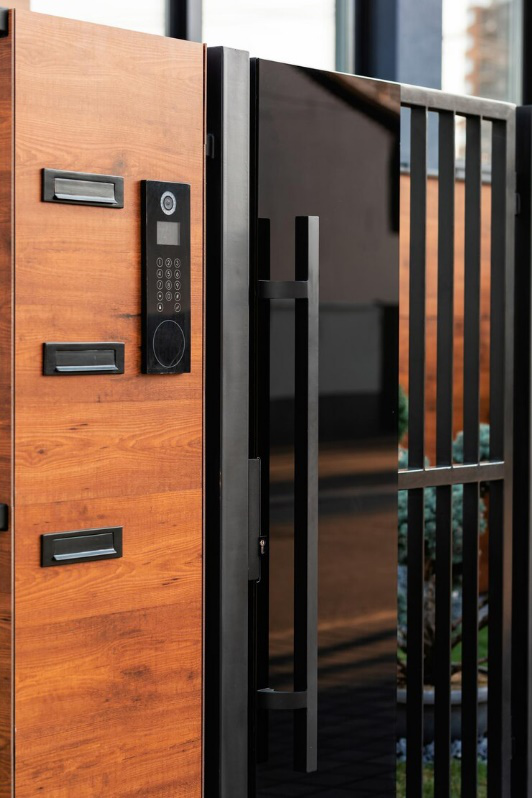 A close-up of a smart lock installed on a metal gate, representing modern security solutions.