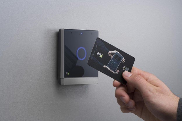 person using a card for entry from an access control system.