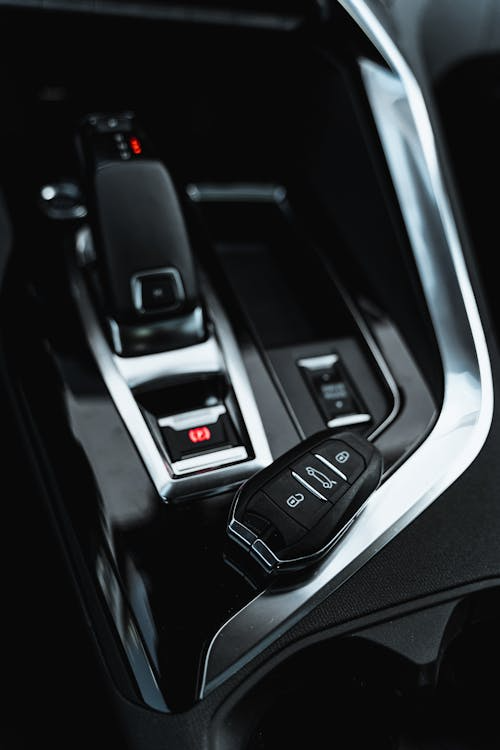 smart car key fob placed near the gear shift.