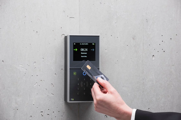 person using an access control system with a card.