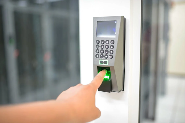 person using biometric fingerprint access control system.