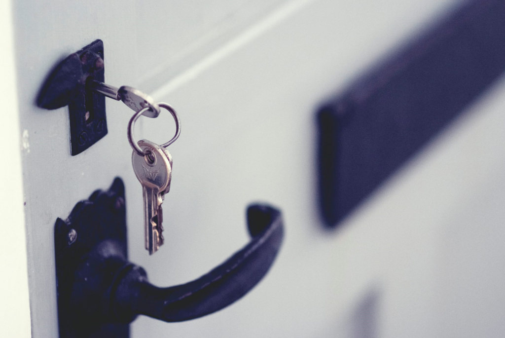 key inserted inside a door’s lock.