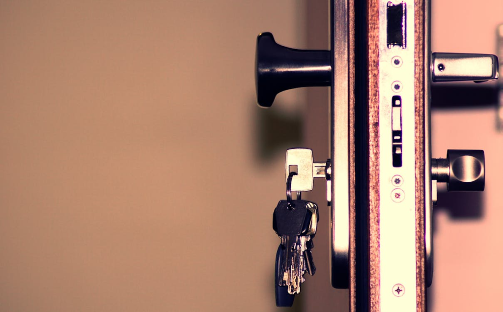 Close-up of a secure front door lock with keys inserted by a residential locksmith in Las Vegas.
