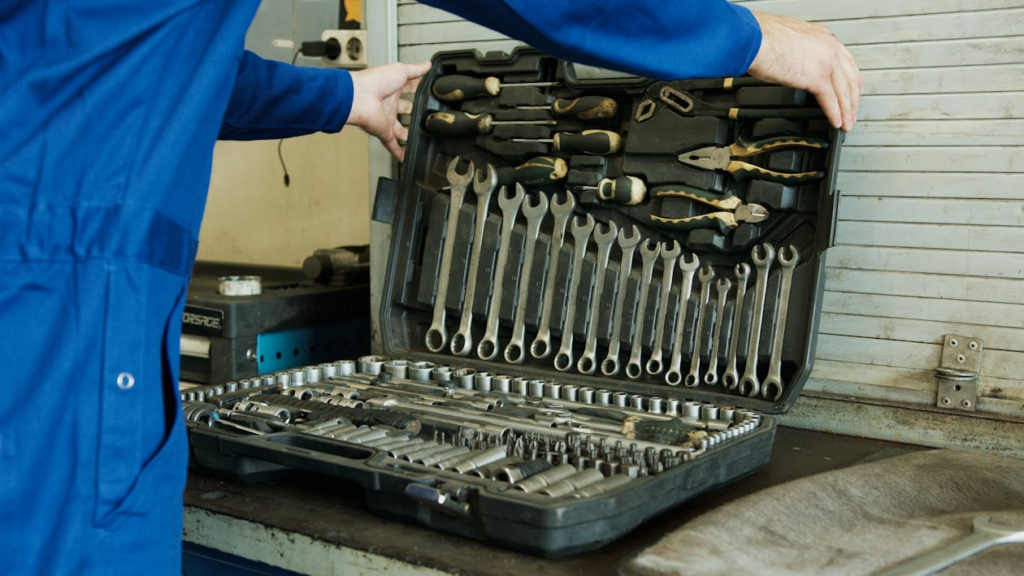 Professional locksmith opening a toolbox filled with wrenches and tools for an emergency locksmith in Las Vegas.