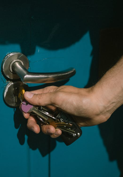 Hand turning the key in the door for a residential locksmith in Las Vegas 