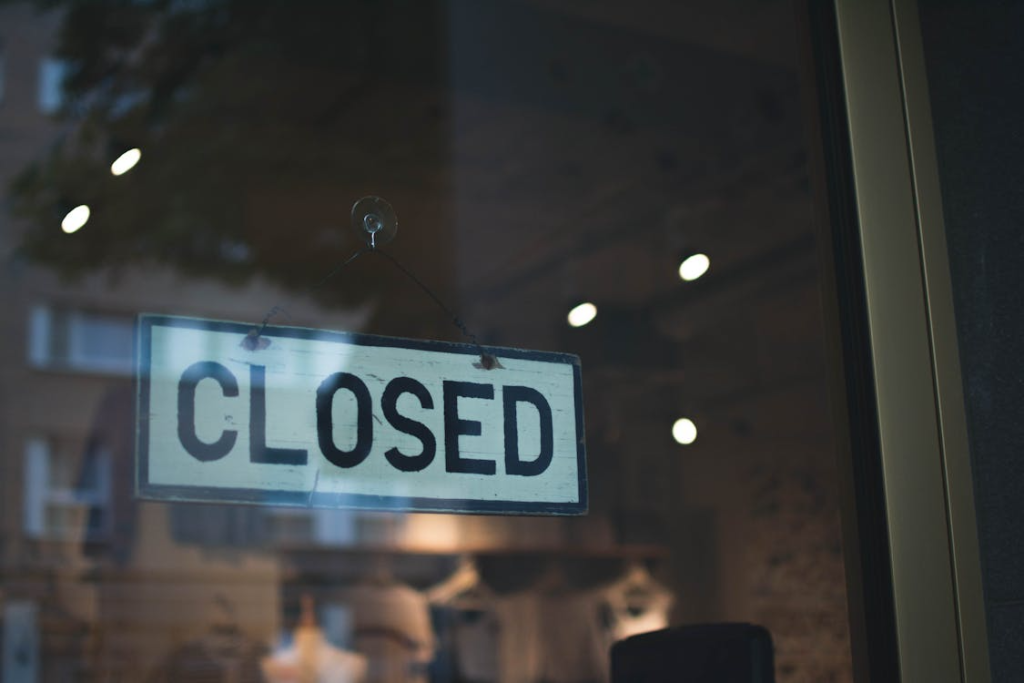 Shop window with a closed sign.