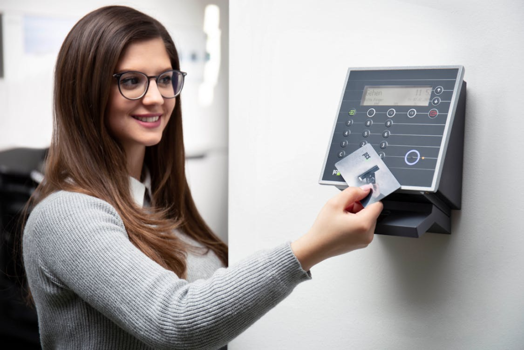 Woman using a secure access card reader installed by a Las Vegas commercial locksmith.