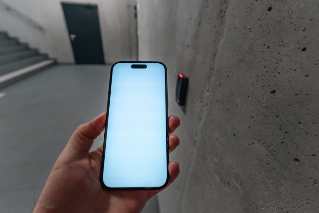Person using a smartphone app for smart lock entry with emphasis on code safety.