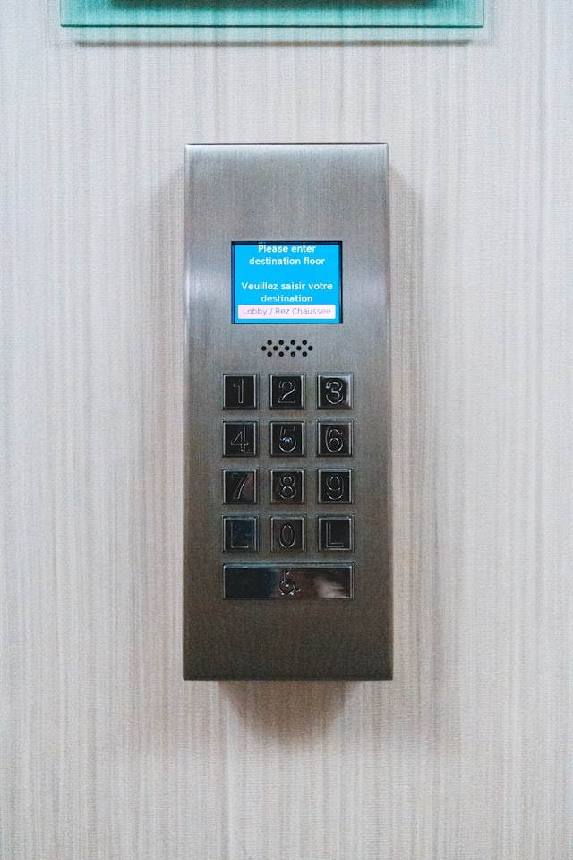 This photo shows a modern digital keypad lock installed on a secure door