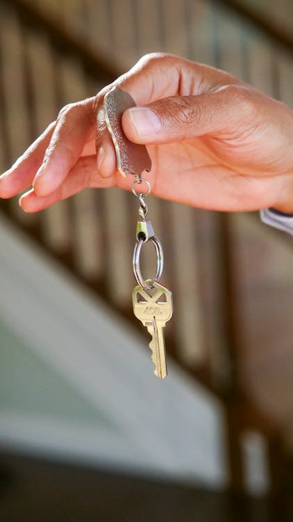 a person dangling keys 