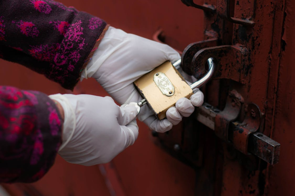 a person opening a lock