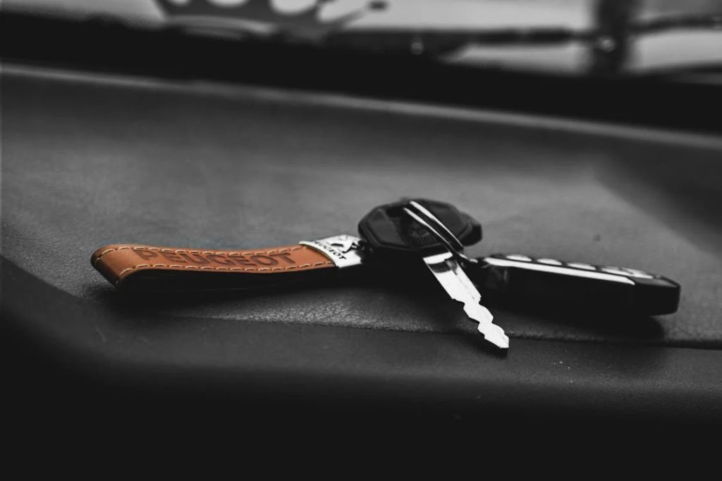 car keys on a black surface 